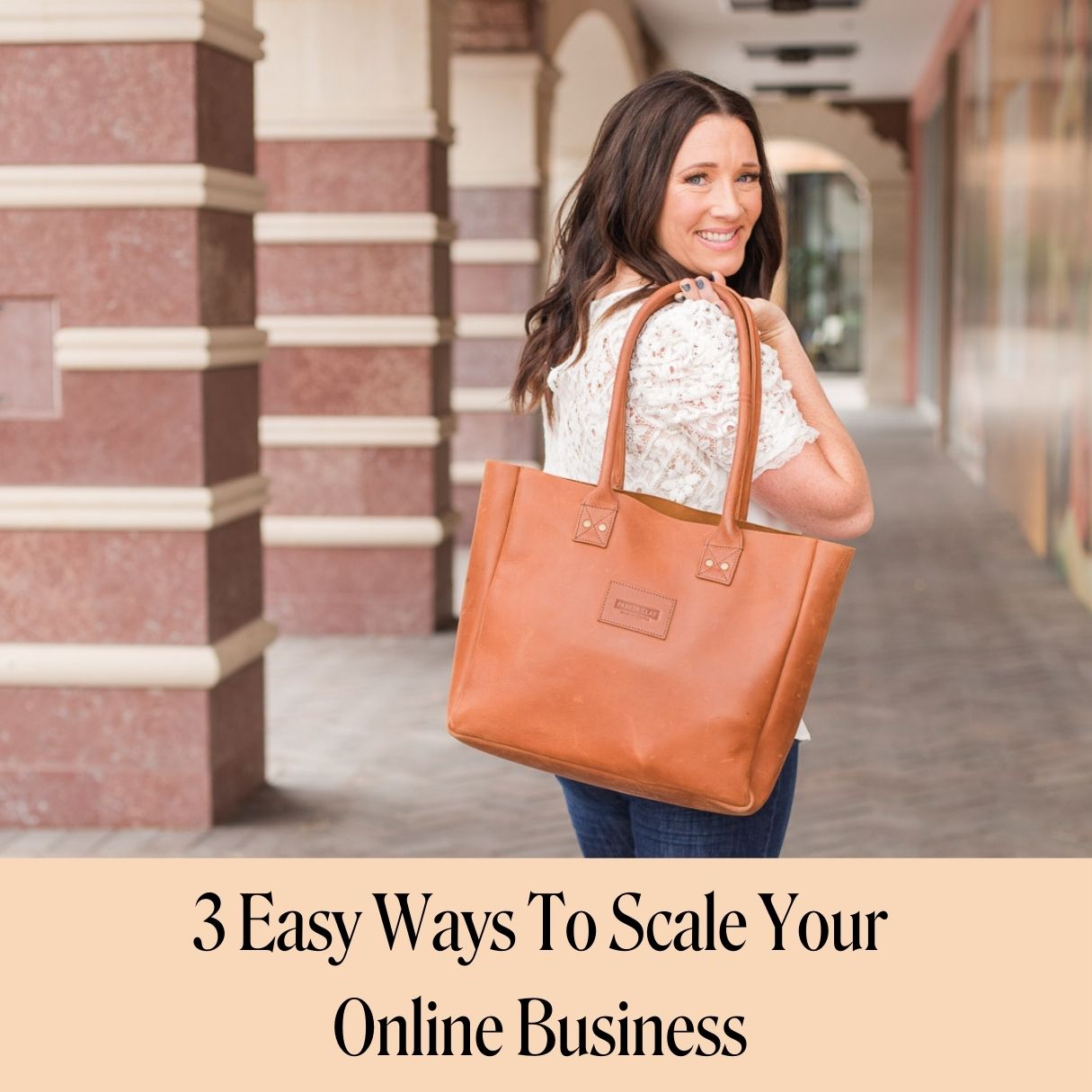 Woman business owner with leather laptop bag